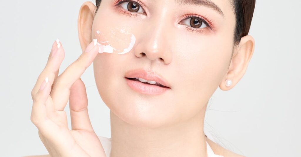 pexels photo 30797181 30797181 A young woman applies skincare cream to her face, promoting a healthy and radiant complexion.