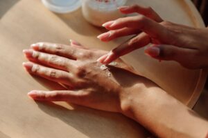 Why Are My Hands So Dry Even When I Moisturize? Here’s 4 Reasons Hands applying moisturizing cream for healthy skin care treatment.