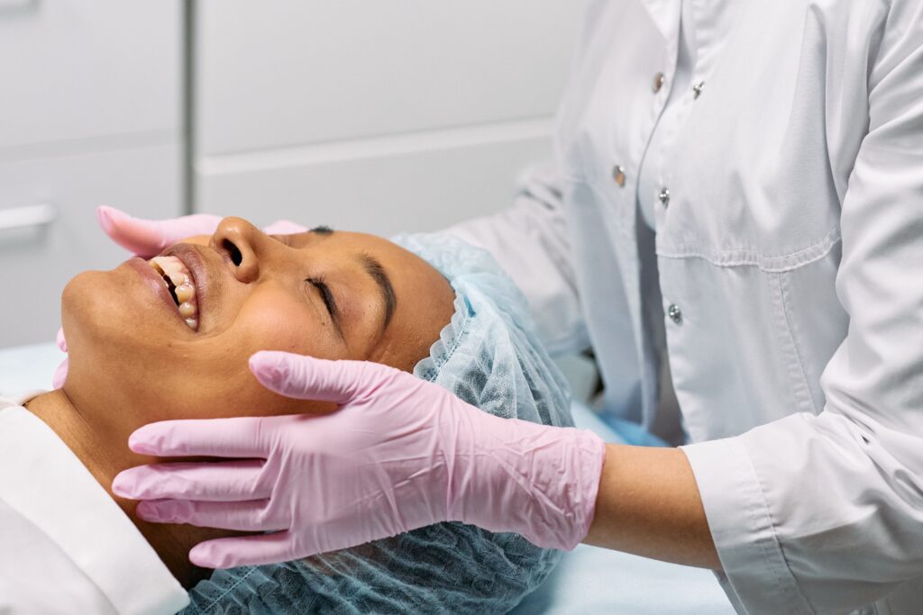 pexels photo 7581075 7581075 A client receiving a relaxing facial treatment at a modern spa clinic.